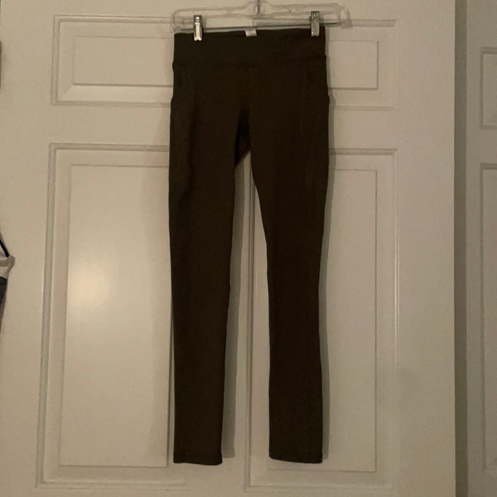 Dark green Ivivva full length low wasted leggings.